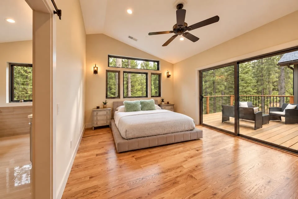 Primary bedroom with king bed and deck access